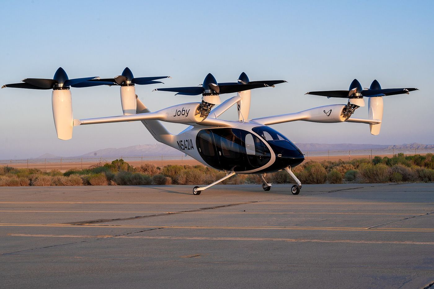 Air Taxis Clear Another Certification Milestone A Joby electric vertical take-off air taxi on a test airfield